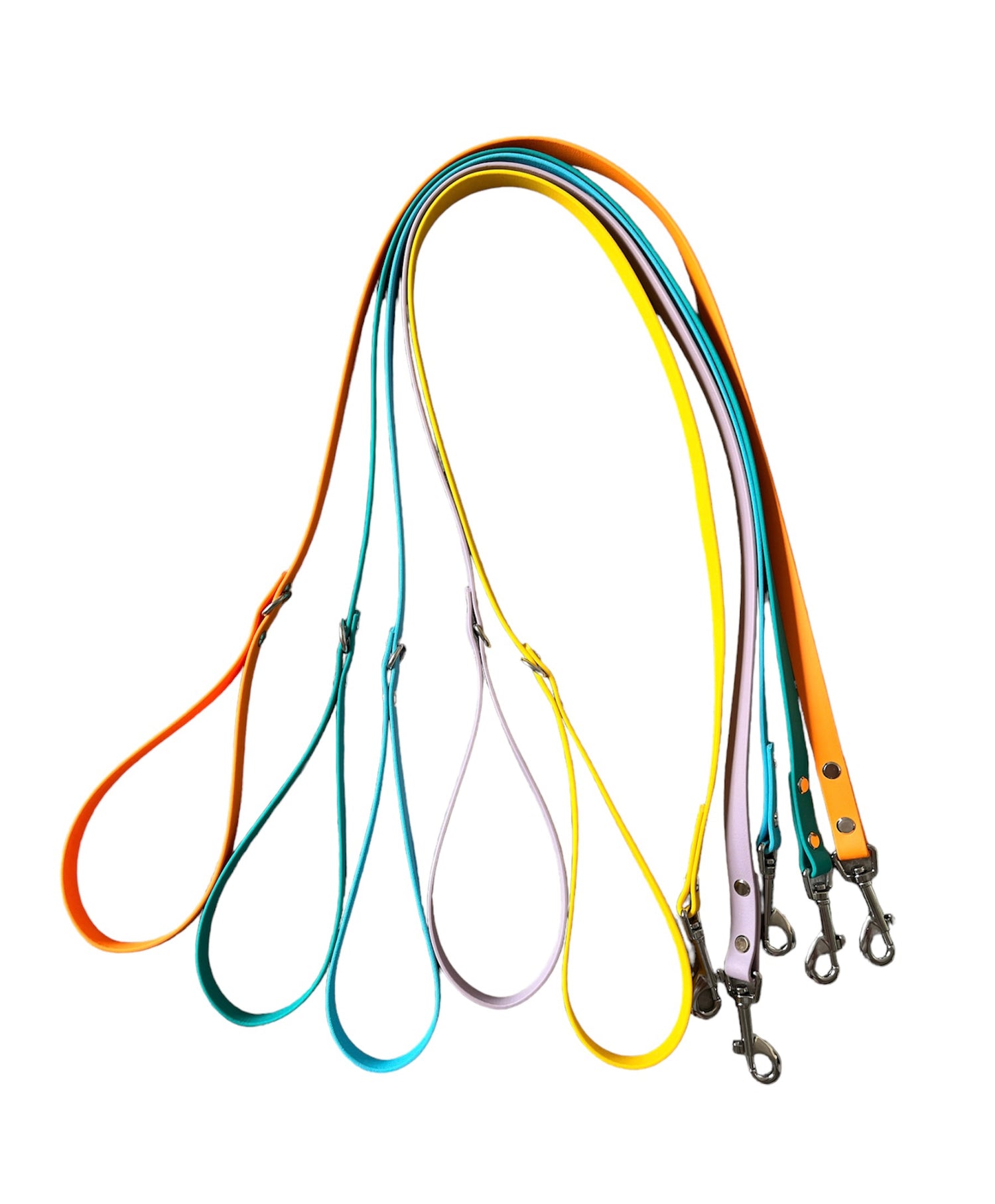 Multiple BioThane dog leads, lined up to show off the handle with D-ring attachment and swivel clip at the opposite end