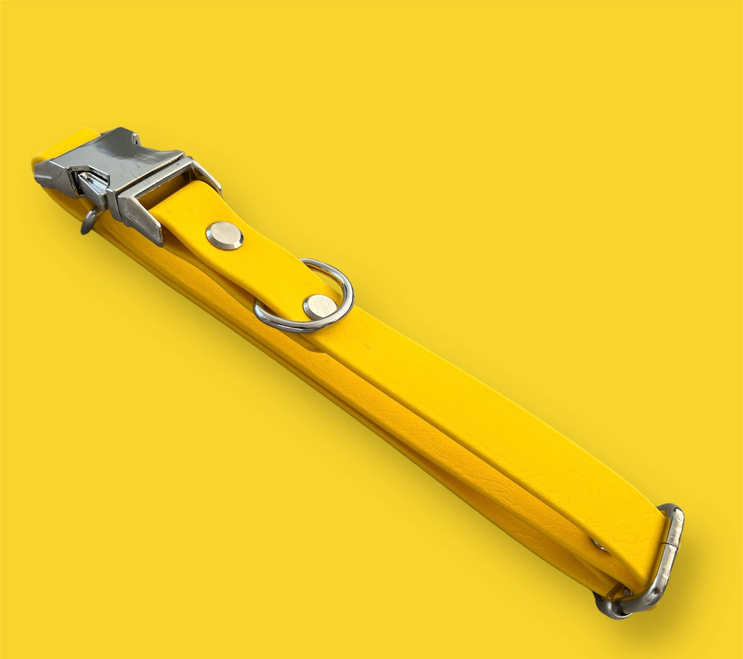 Quick-release BioThane® dog collar in Sunny Yellow, featuring a sturdy plastic buckle for easy on-and-off, with a sleek, waterproof, and durable design.