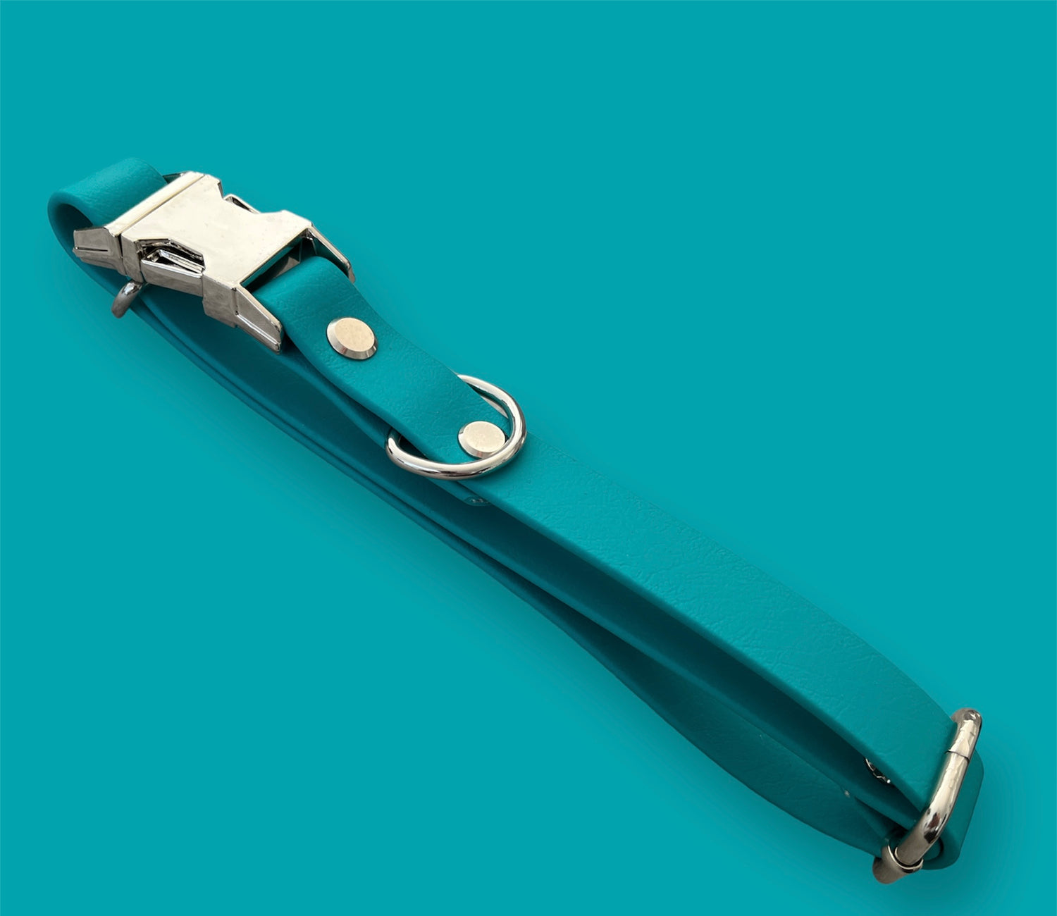 Quick-release BioThane® dog collar in Teal, featuring a sturdy plastic buckle for easy on-and-off, with a sleek, waterproof, and durable design.